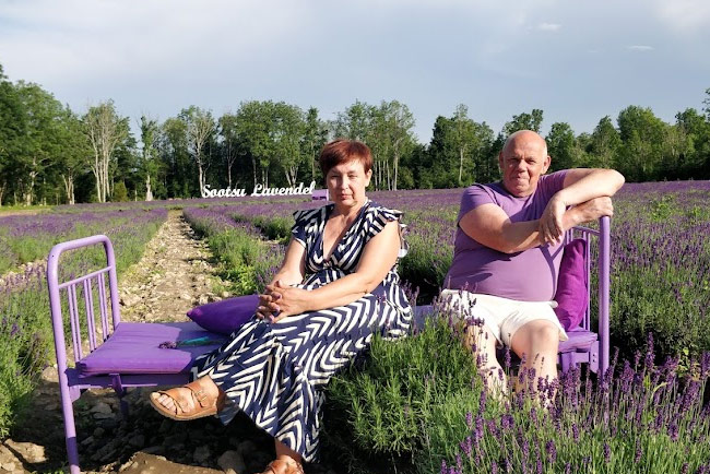 Owners of Sootsu Lavender Farm sitting in a lavender field